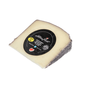 παλαιωμένη γραβιέρα σε οινολάσπες επιλεγμένου κρασιού. aged graviera in the red wine